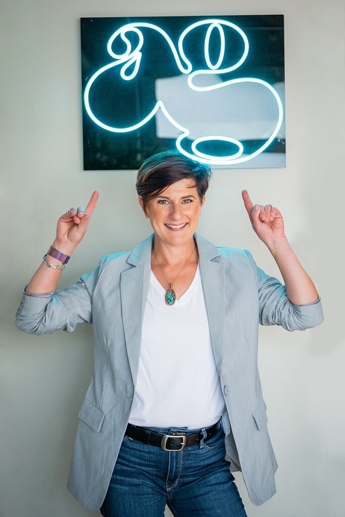 christine walsh, president under an alpha graphics sign
